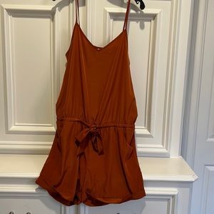 The adorable romper 30 inches long and 20 inches across.